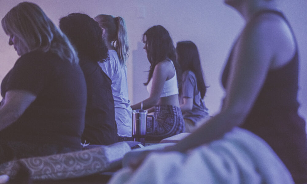 mind body reset with mayuly magnavita facilitating a meditation experience for a group at the healing tree collective in tempe, az