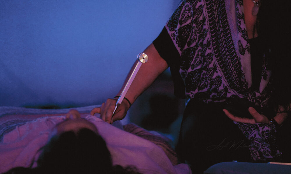 Salena Coronado offering tuning fork therapy at the healing tree collective in tempe, az