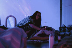 Salena Coronado facilitating tuning fork therapy at The Healing Tree Collective in Tempe, Arizona