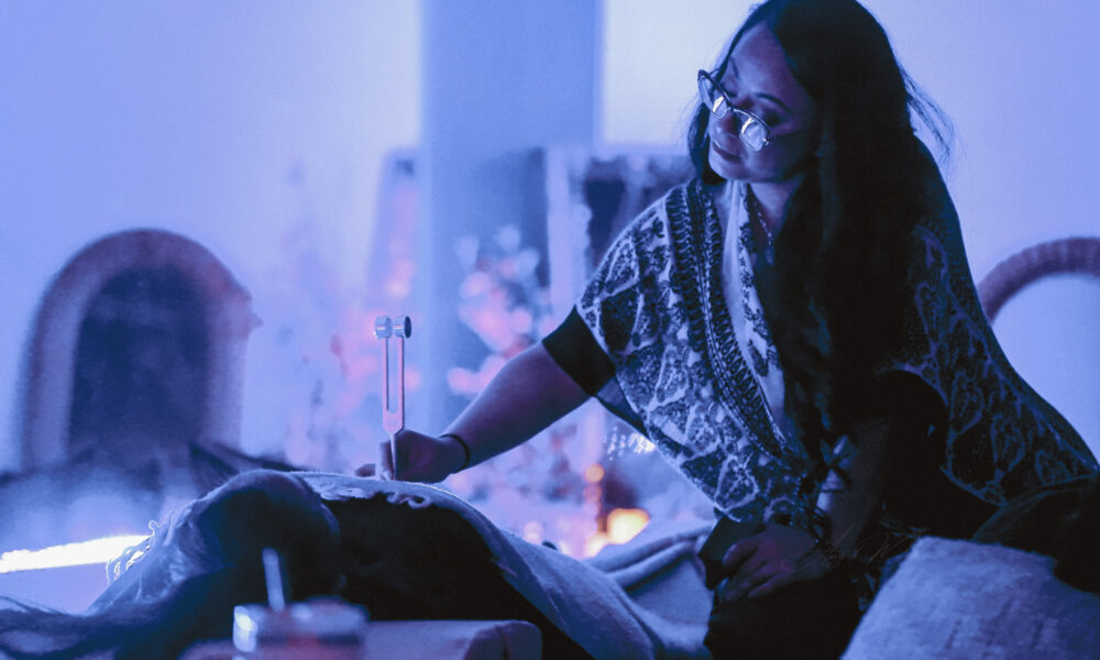 Salena Coronado offering tuning fork therapy at the healing tree collective in tempe, az