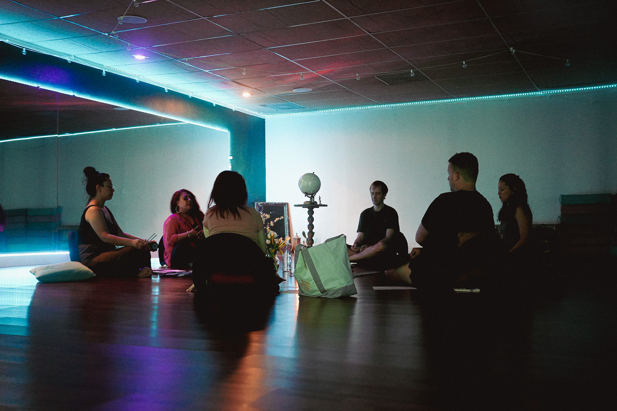 Global Heart Activation community gathering centered on a shared theme at The Healing Tree Collective